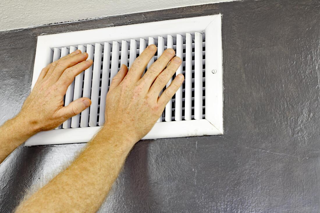 man holds the air vent